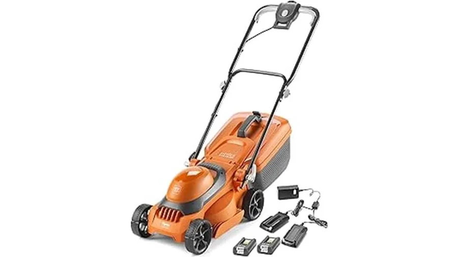 Cordless lawn mower being used on a UK garden lawn
